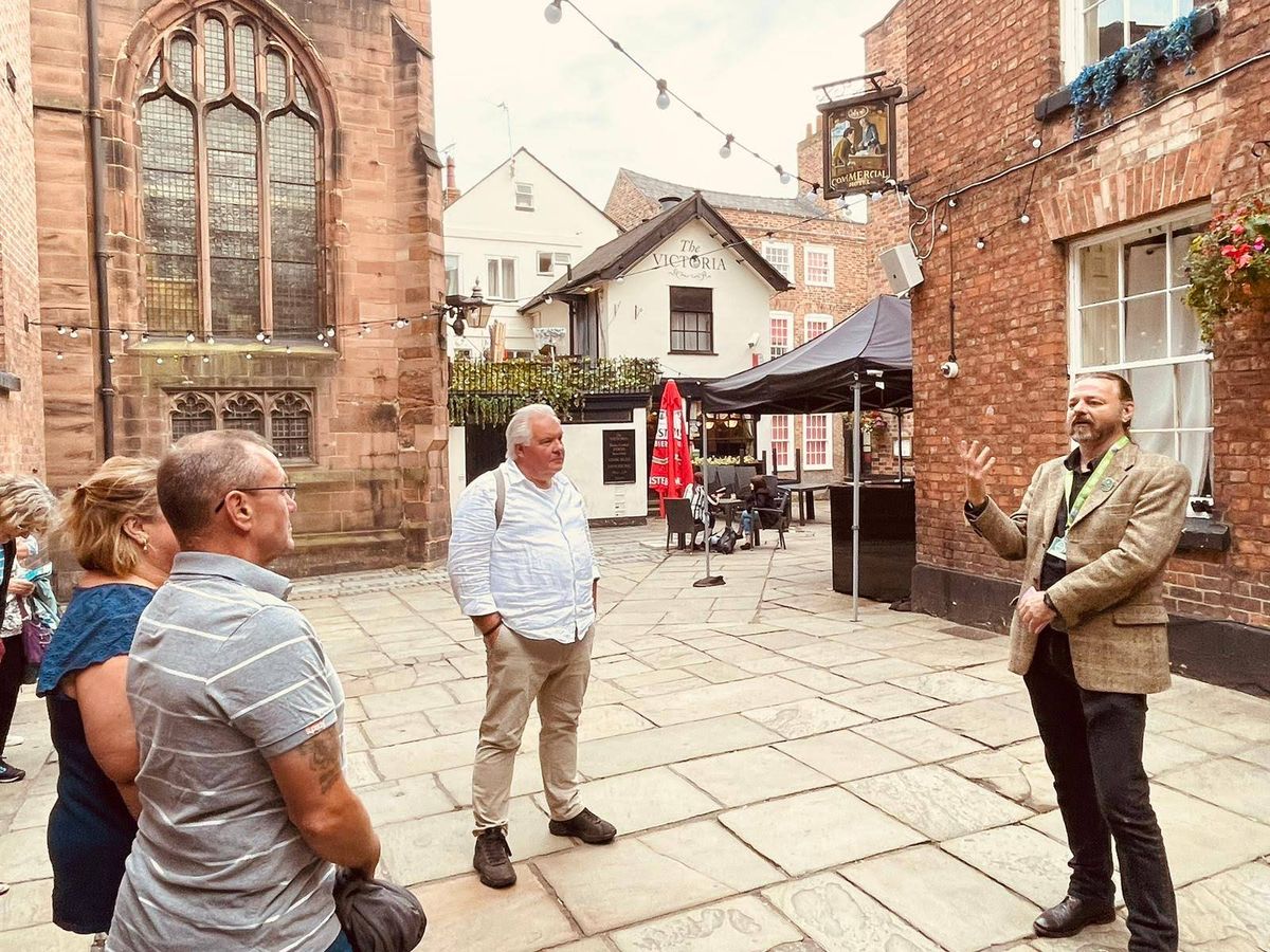 David Appleyard guiding visitors in a historic setting